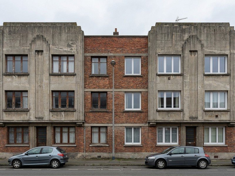 Fenêtres à remplacer sur la façade d'un immeuble en copropriété des Gratte-Ciel à Villeurbanne